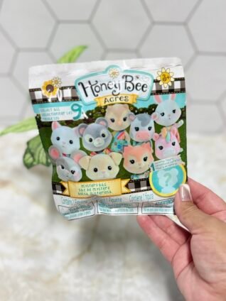 Honey Bee Acres Mystery Bag featuring a surprise flocked animal collectible