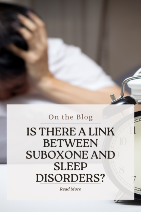 A person sitting in bed holding their head in distress, with an alarm clock in the foreground. Text overlay asks, "Is There a Link Between Suboxone and Sleep Disorders?