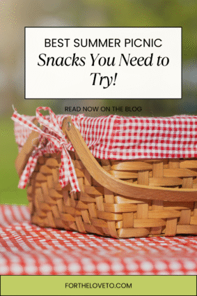 Wicker picnic basket with red gingham cloth on a picnic table, featuring text overlay: "Best Summer Picnic Snacks You Need to Try! Read now on the blog fortheloveto.com". Perfect Pinterest pin promoting family-friendly summer picnic snack ideas.