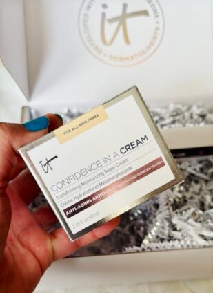 Close-up of IT Cosmetics Confidence in a Cream box in hand.”