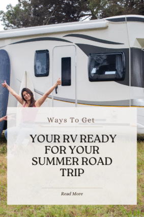 Woman smiling and giving thumbs up next to RV ready for summer travel