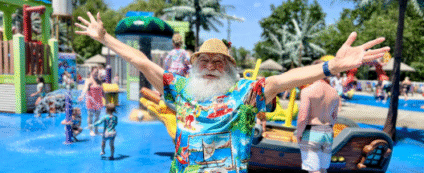 Santa enjoying the splash area at Dutch Wonderland’s Santa’s Beach Bash, a fun-filled July event featuring storytime, dance parties, and meet-and-greets.