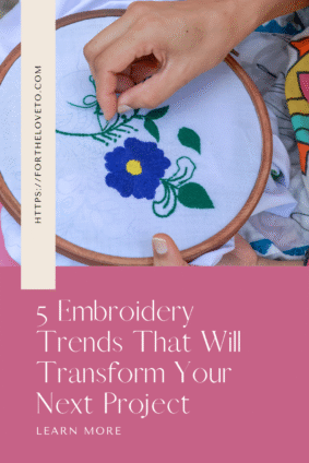Colorful floral embroidery hoop project with blue flower and green leaves – modern embroidery trend for beginners