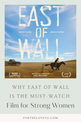 Pinterest image promoting East of Wall movie, highlighting the phrase “Must-Watch Film for Strong Women” with a dramatic scene of a woman riding a horse across the Badlands.
