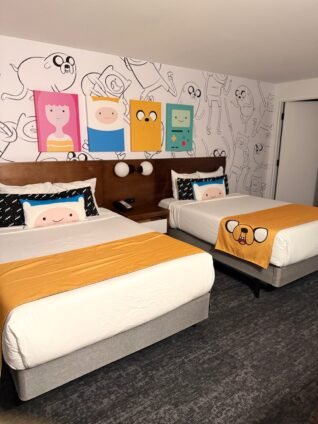 Adventure Time suite at Cartoon Network Hotel weekend getaway featuring Finn and Jake wall art