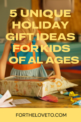 A young girl in a blue and orange dress excitedly unwrapping a gift box with animal-themed wrapping paper. Large yellow text overlay reads '5 Unique Gift Ideas for Kids of All Ages' with fortheloveto.com branding at the bottom.