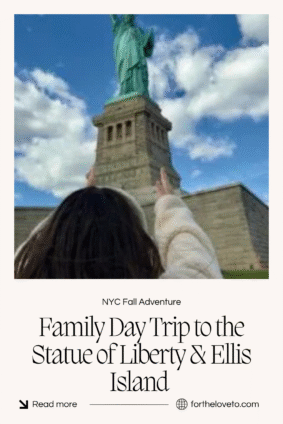 A child reaching up toward the Statue of Liberty under bright fall skies, symbolizing family travel and educational day trips in New York City with Statue City Cruises.