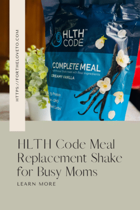 HLTH Code Meal Replacement Shake in Creamy Vanilla flavor displayed beside fresh greenery, promoting a quick and nutritious meal for busy moms.