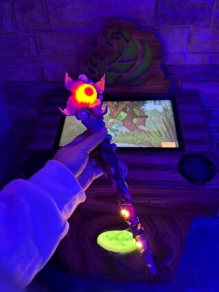 Glowing MagiQuest wand used by kids during the interactive game at Great Wolf Lodge.