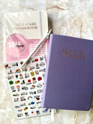 Planners With Purpose self-care planner with wellness stickers used for New Year goal setting and daily self-care routines.