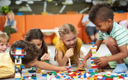 Kids building and creating together with colorful blocks showing why families are bringing back group play for screen-free fun and connection