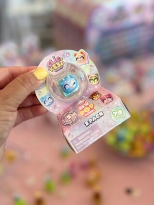 Clickeez collectible figures on display at Sweet Suite featuring colorful mystery characters.
