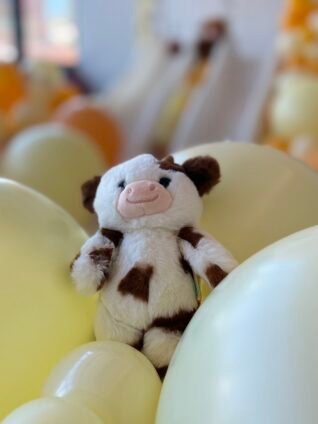ButterLuvs plush display at Sweet Suite featuring oversized stuffed animals and a colorful ball pit.