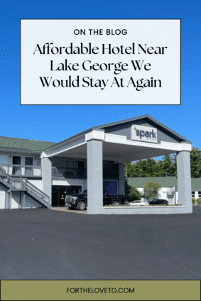 Spark by Hilton Lake George Outlets Review Pinterest pin featuring the hotel exterior with the headline "Affordable Hotel Near Lake George We Would Stay At Again."