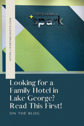 Pinterest graphic for our Spark by Hilton Lake George Outlets Review featuring the modern Spark by Hilton lobby and the text "Looking for a Family Hotel in Lake George? Read This First!"