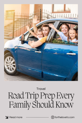 Happy family waving from a blue car while following a family vehicle checklist for summer road trips before their next vacation.