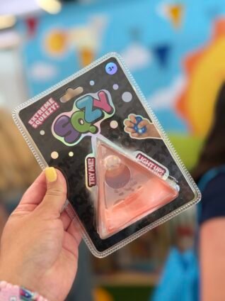 Sqzy light-up sensory toy from the toy brands at Sweet Suite, featuring a fun squeezable fidget toy.