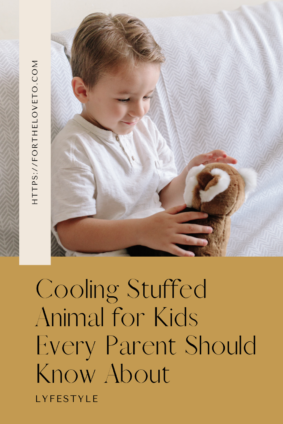 Young child smiling while holding a Warm Pals cooling stuffed animal for kids.