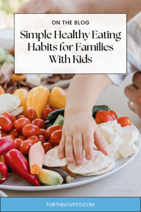 Child reaching for fresh vegetables and healthy snacks, promoting simple healthy eating habits for families with kids.