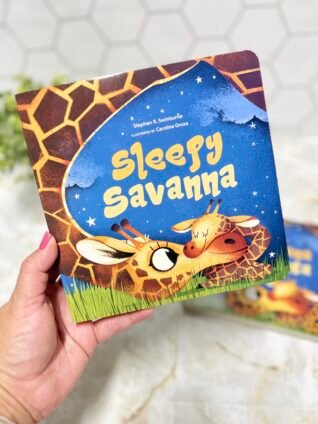 Hand holding Sleepy Savanna, a bedtime board book featuring baby giraffes on the cover.