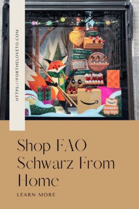 FAO Schwarz Amazon window display with a fox, plush toys, and gift boxes beneath “Shop FAO Schwarz From Home.