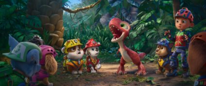 The PAW Patrol pups and Ryder meet a red dinosaur on a jungle island in PAW Patrol: The Dino Movie.