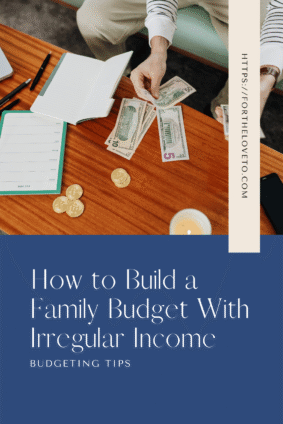 Person counting cash beside an open notebook and weekly planner, with text reading “How to Build a Family Budget With Irregular Income.”